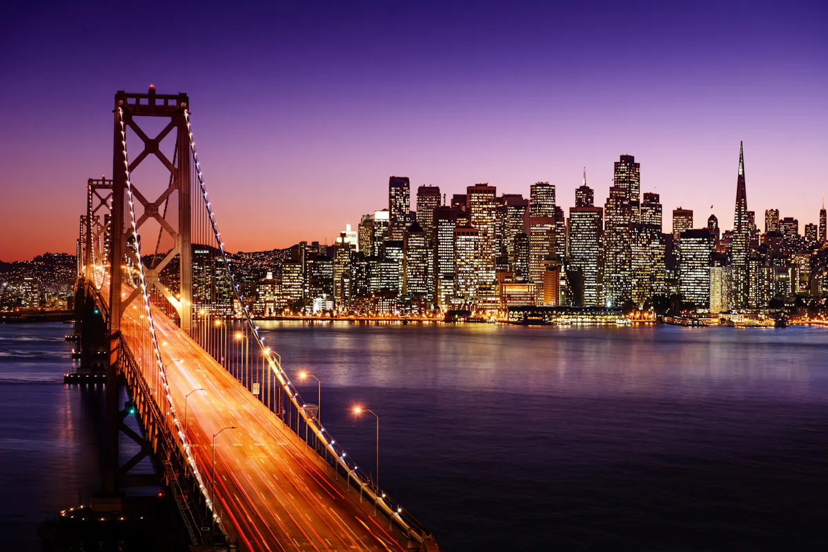 San Francisco skyline at night across golden gate bridge