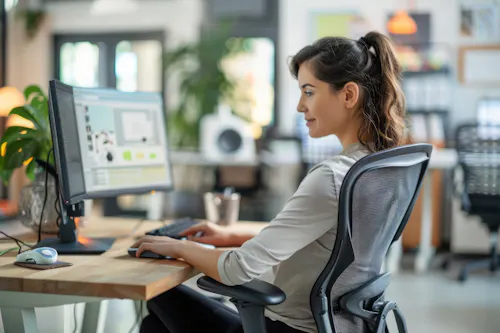 Woman working on ai models at computer